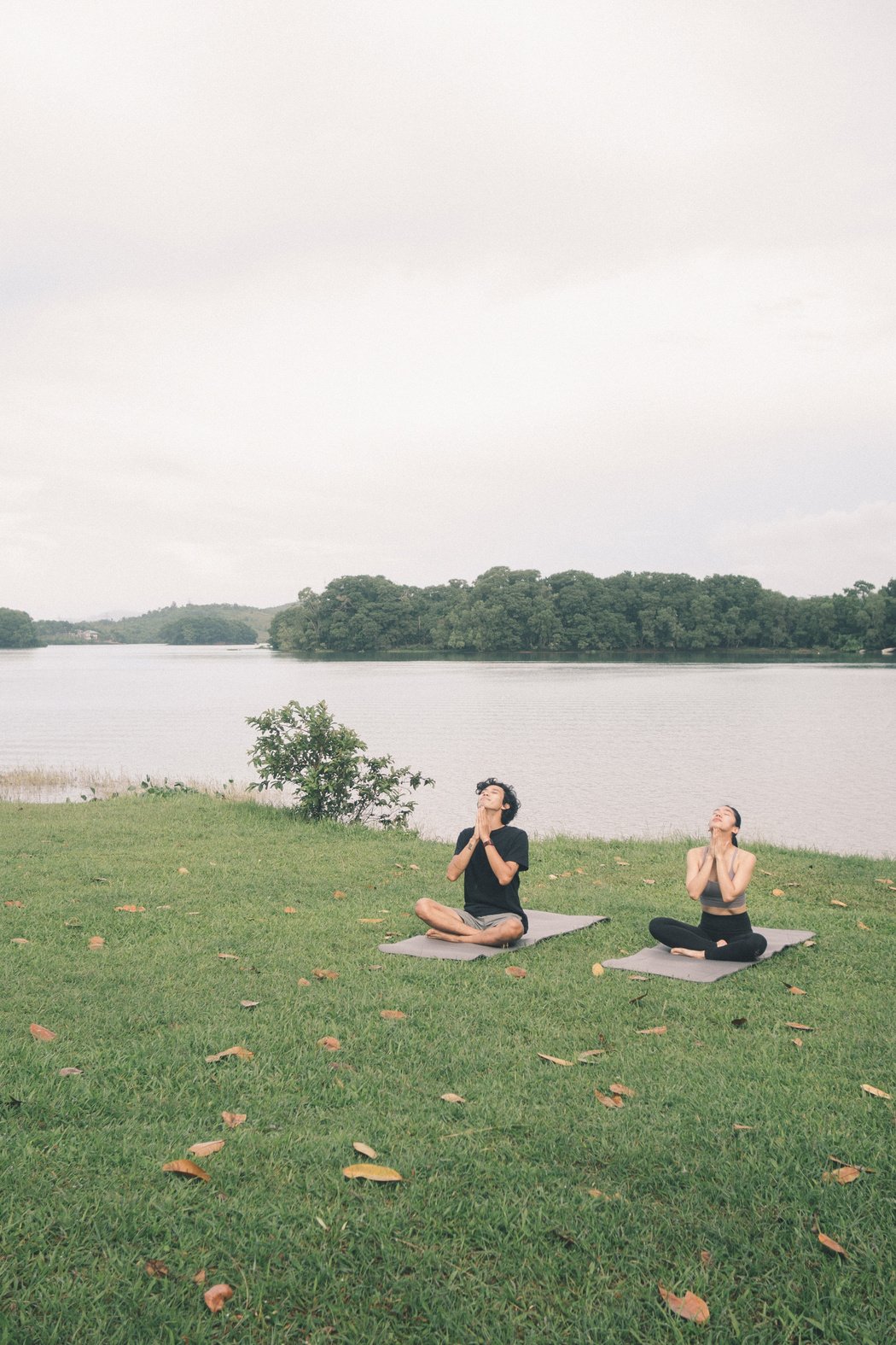 Couple Doing Yoga Outdoors